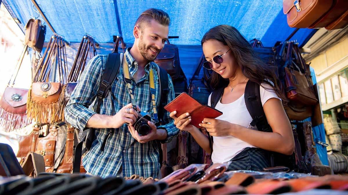 Couple Browses Wallet Souvenirs Low 1