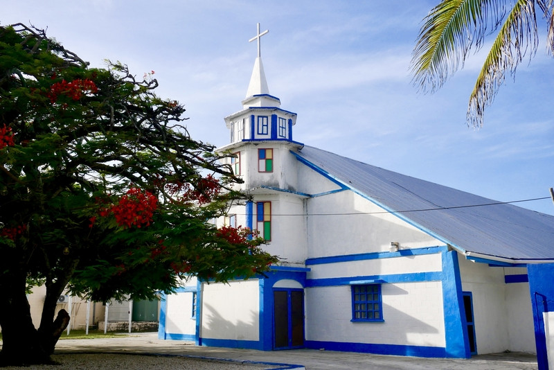 A blue and white church stands prominently in downtown Majuro, reflecting the local religious community