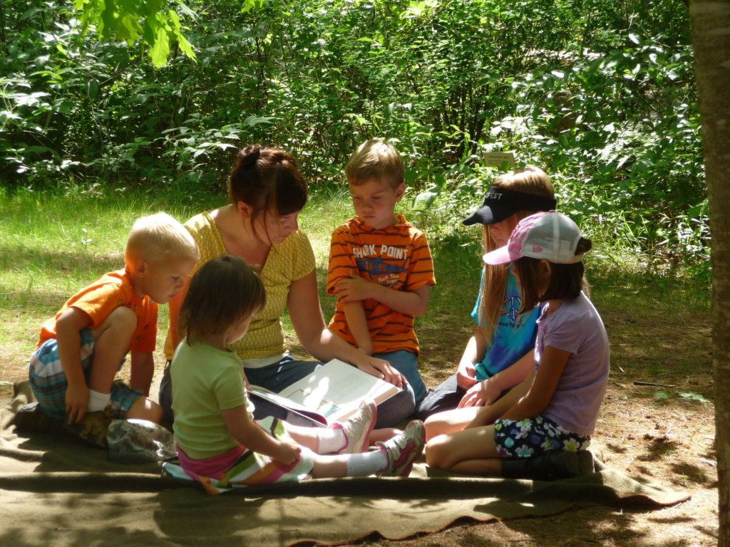 group of kids learning outside