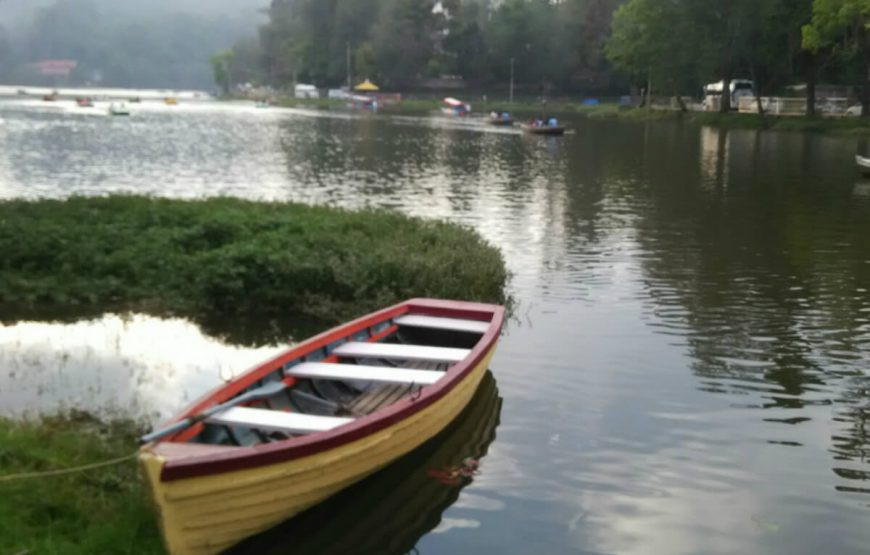 Boating in Kodaikanal Lake offering a serene and picturesque experience, often included in Tamil Nadu tour packages