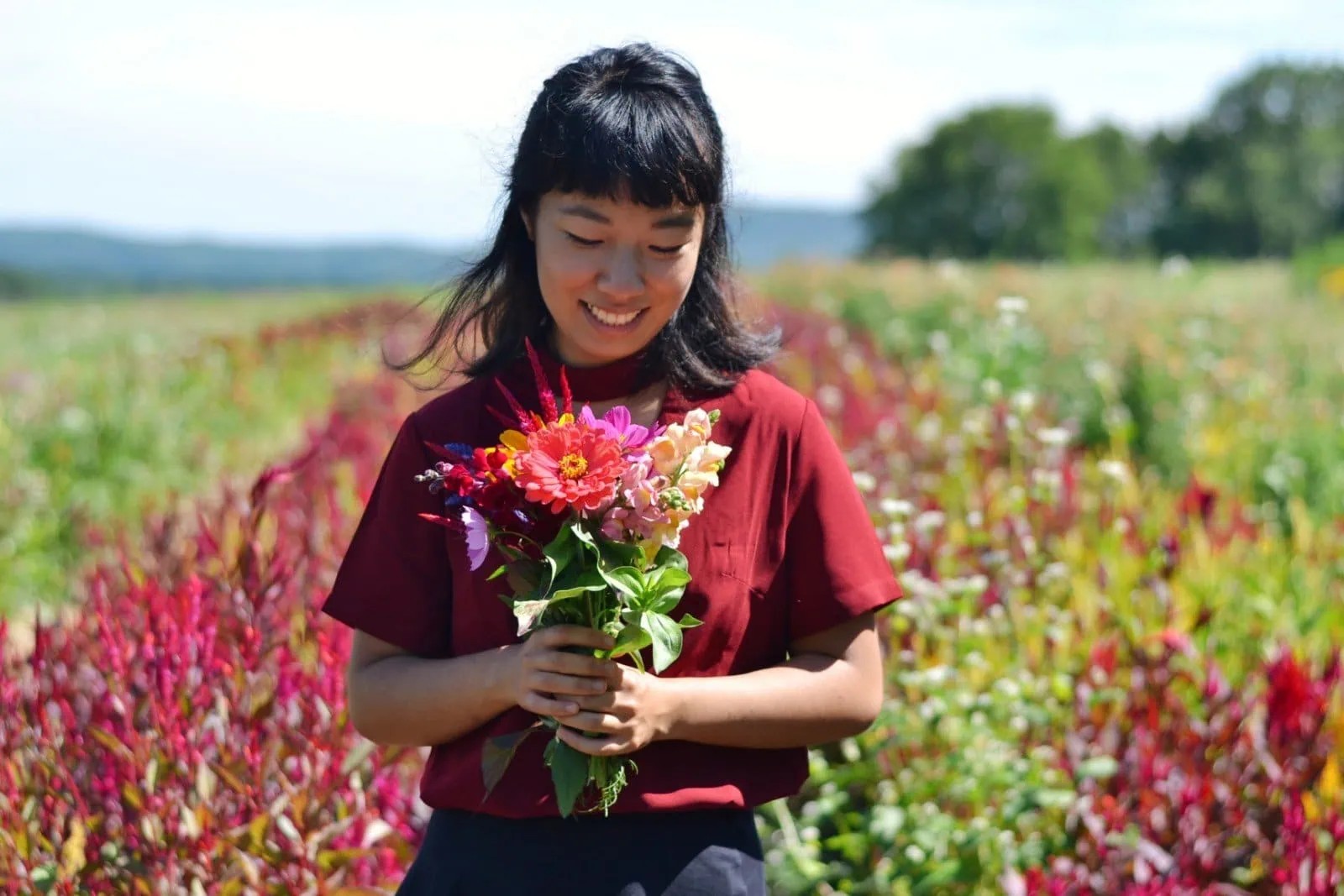 Person holding bouquet at Book and Plow Farm