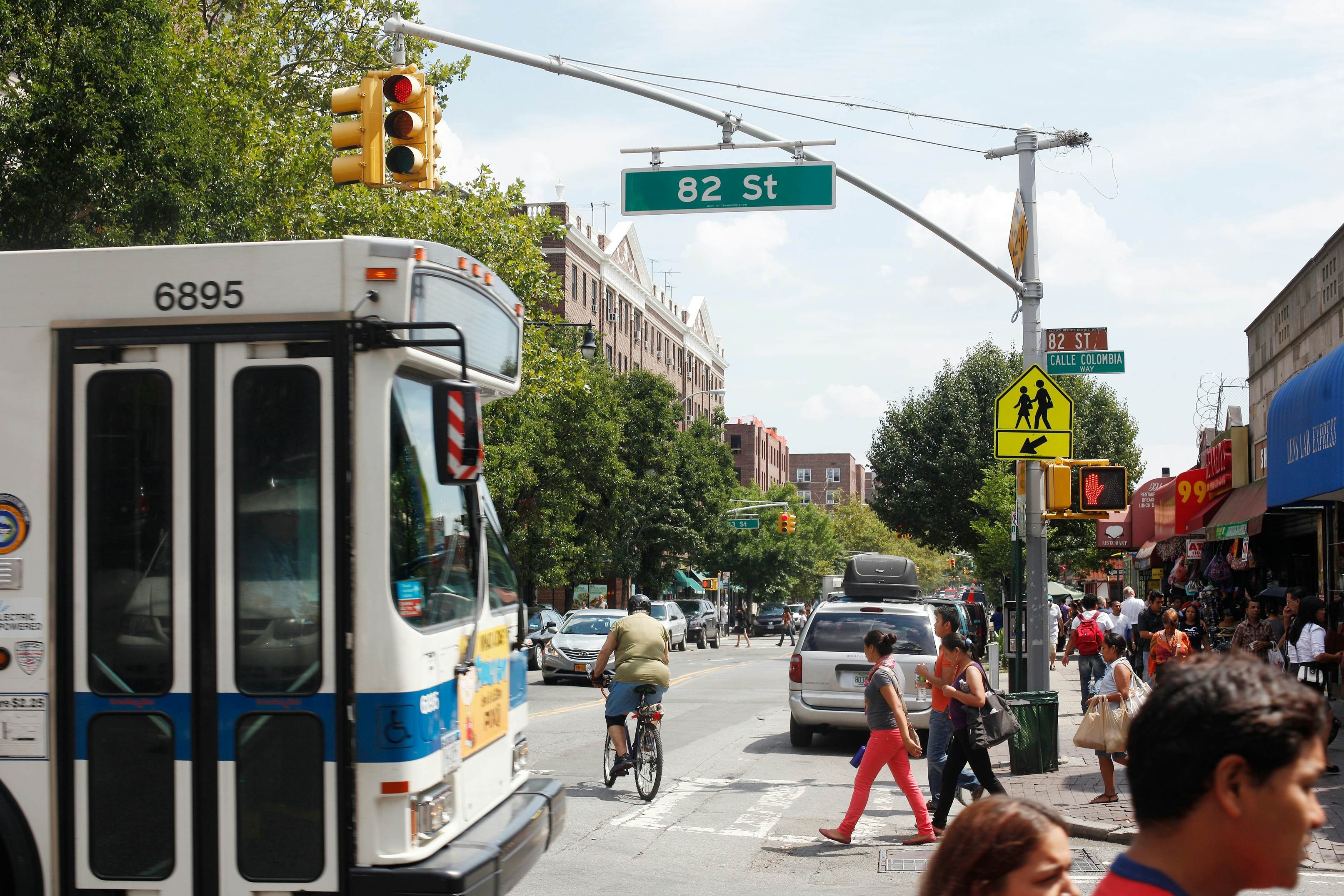 NYC bus traveling down a street