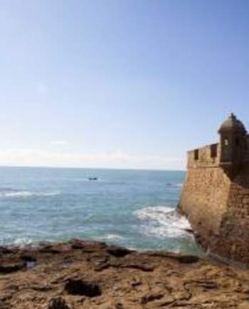 Aerial view of Cadiz, Spain alt text: The stunning aerial view of Cadiz's coastline, highlighting Spain's historic port city and coastal charm for Andalusia tourism