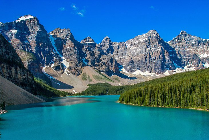Turquoise waters of Moraine Lake surrounded by mountains
