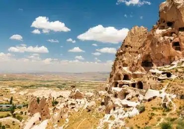 Hikers traversing the Rose Valley in Cappadocia, enjoying the unique pink rock formations.