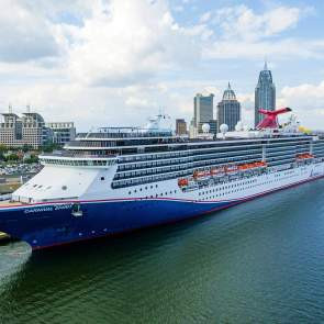 Cruise ship sits docked in the port of Mobile Alabama, offering relaxing vacations