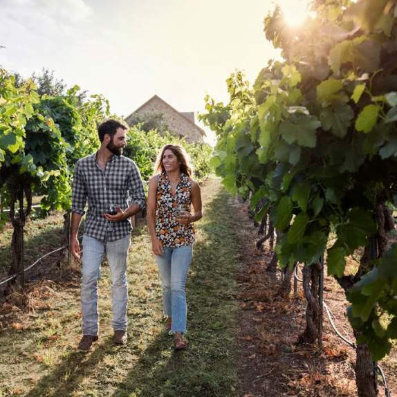 Couple enjoying vineyard tour