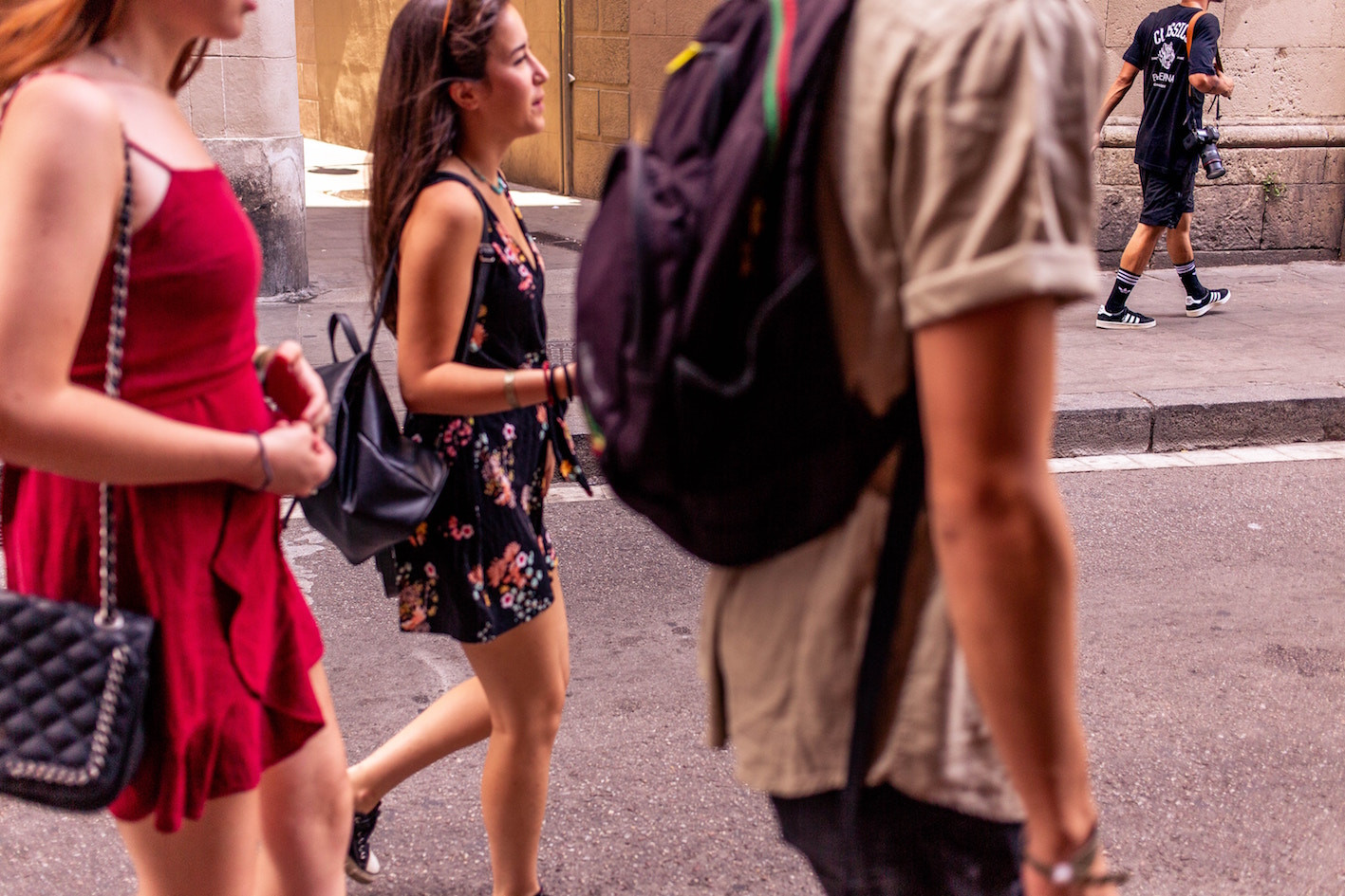A Barcelona street scene with a mix of tourists and locals, highlighting the city's vibrant yet complex social environment