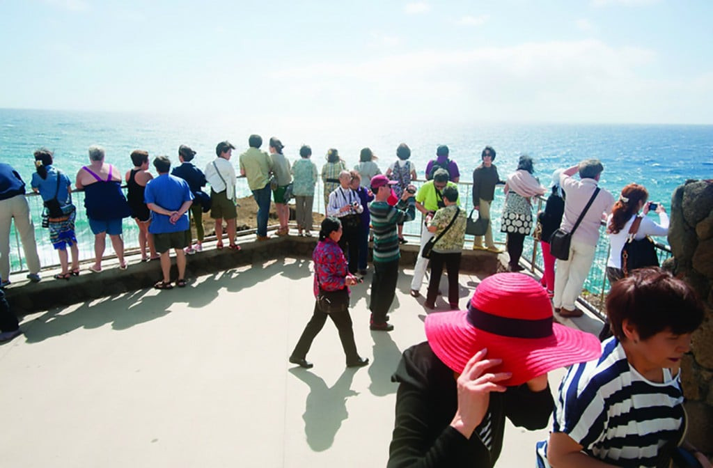 Chinese tourists exploring Oahu