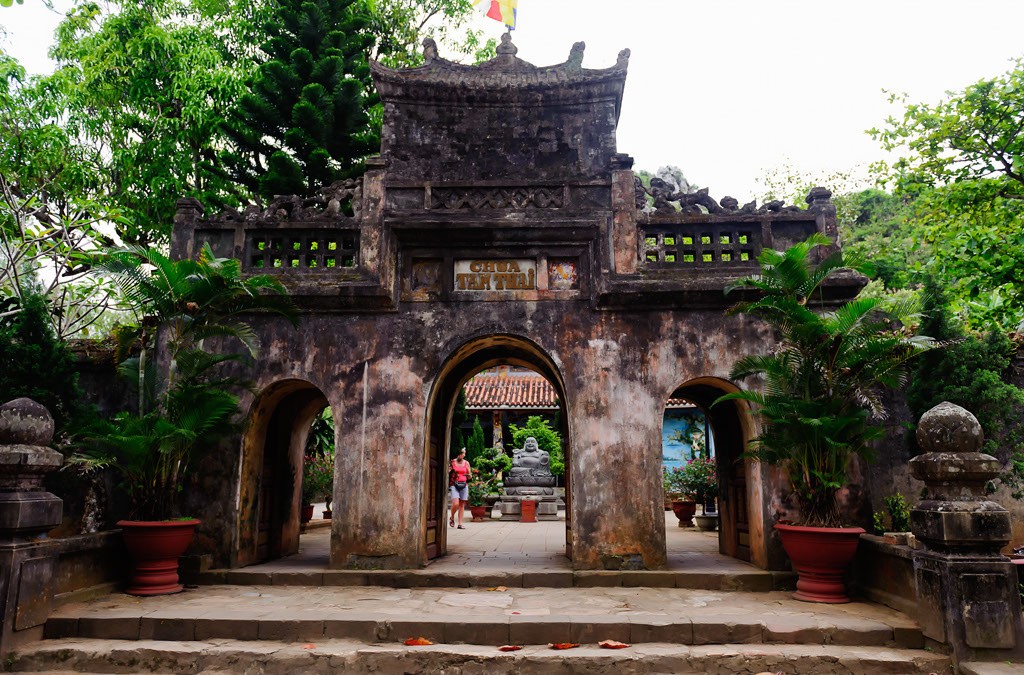 Tam Thai Pagoda in Marble Mountains, Da Nang, featuring a giant Maitreya Buddha statue and beautiful bonsai trees