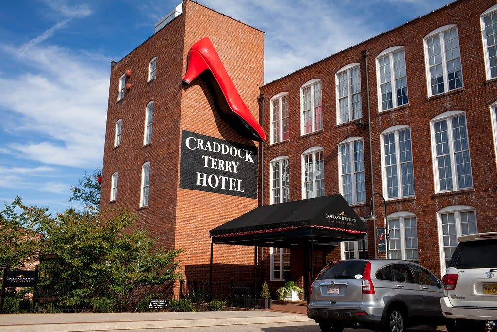External view of the Craddock Terry Hotel, showcasing its red brick facade and historic architecture in Lynchburg, Virginia