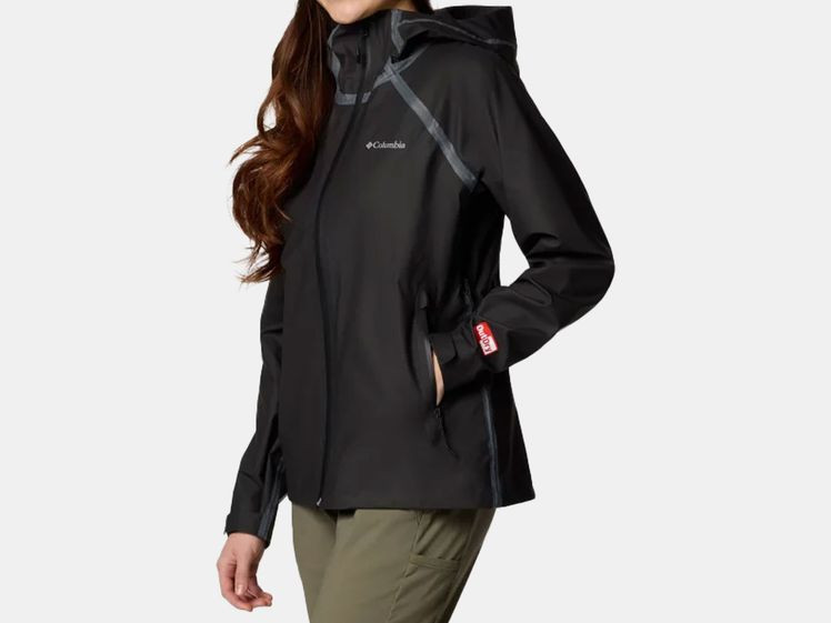 Woman wearing short, black rain jacket