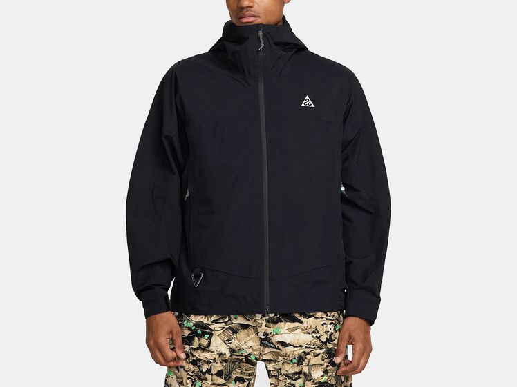 Man wearing short, black rain jacket