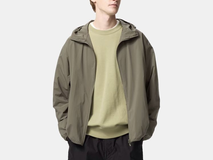Man wearing olive green rain jacket