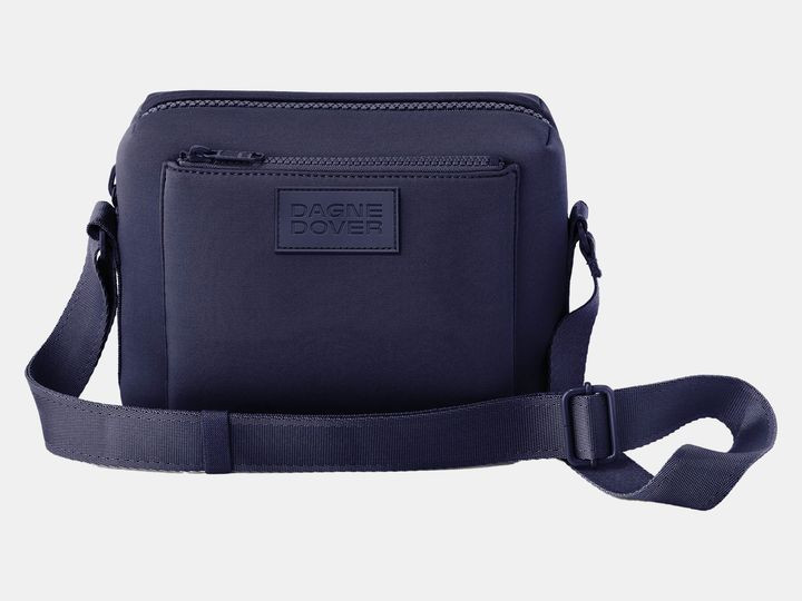 Dagne Dover's vegan neoprene crossbody bag in navy blue.
