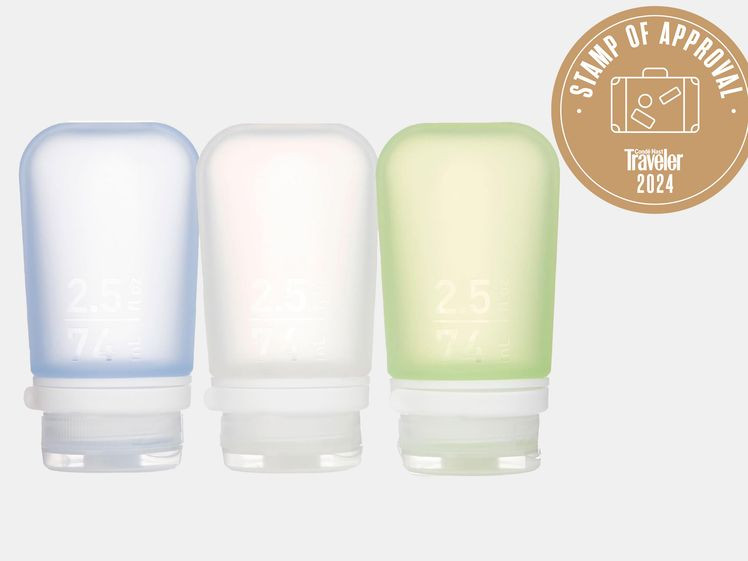 Three colorful silicone reusable toiletry bottles
