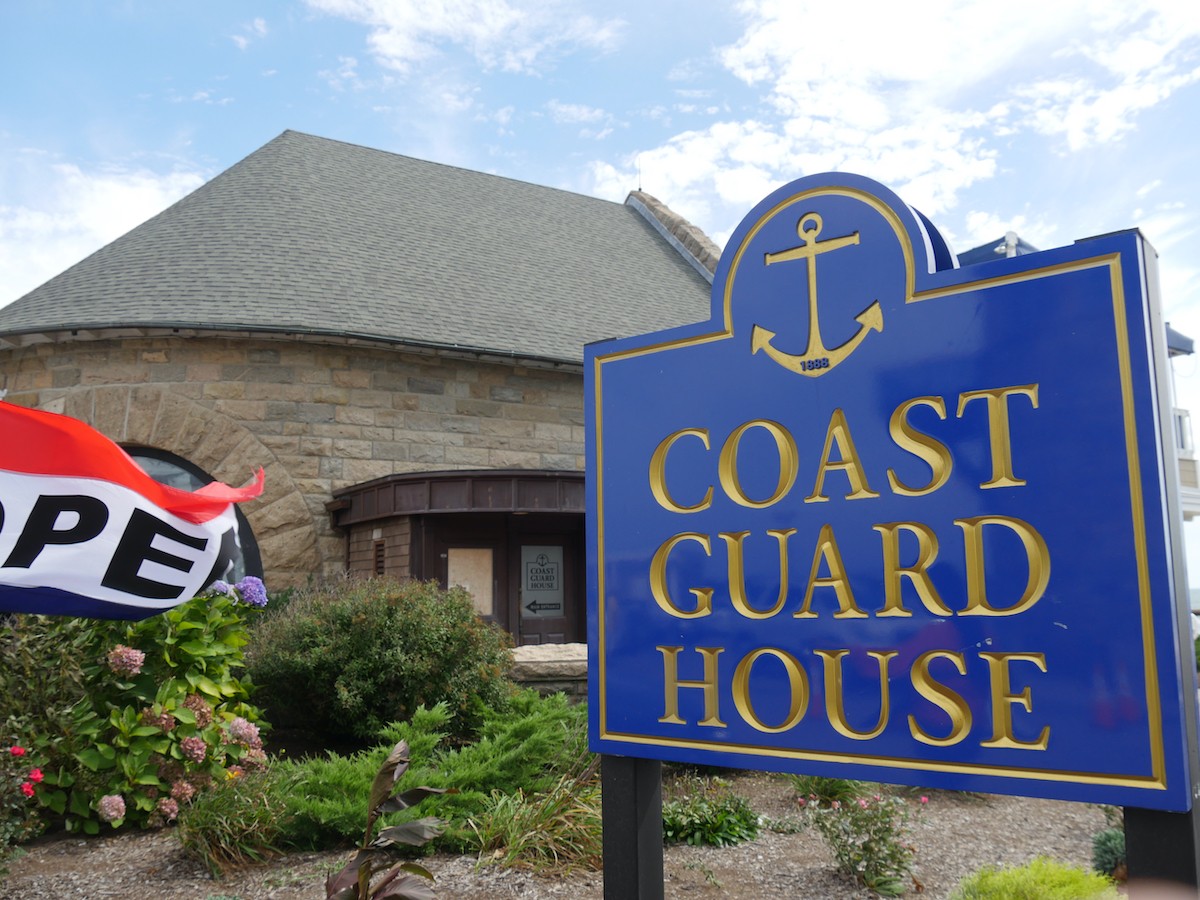 Coast Guard House sign next to the Narragansett Towers