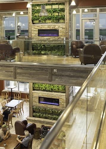 Coffee Cup Travel Plaza showcasing a living wall, providing a refreshing and eco-friendly environment for travelers
