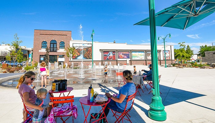 People enjoying live music and community events at the Downtown Commons in Twin Falls