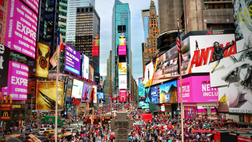 Crowd in Times Square showing the impact of mass tourism