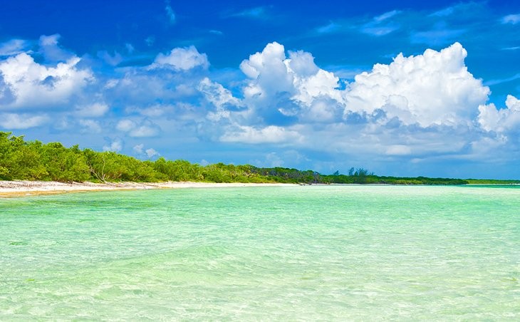 Turquoise waters and white sand beaches of Cayo Coco, Cuba, under a bright sky