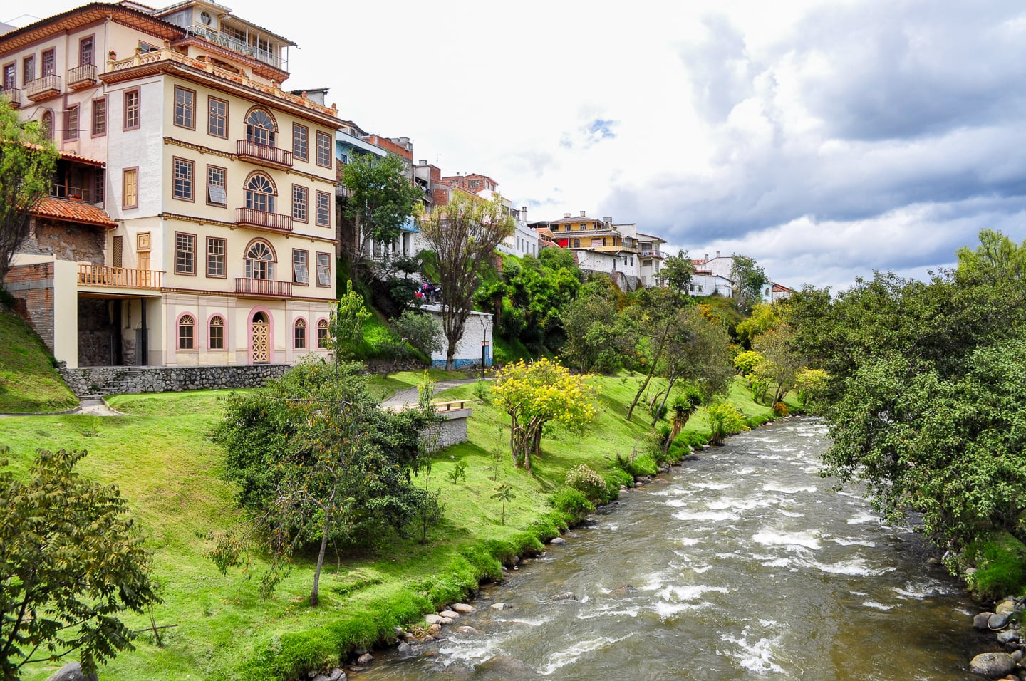 Enjoying a peaceful walk along the Tomebamba River, capturing its scenic beauty