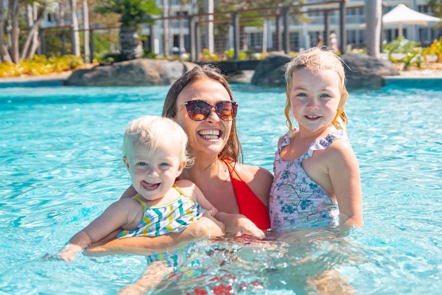 Family enjoying a resort pool in Cairns