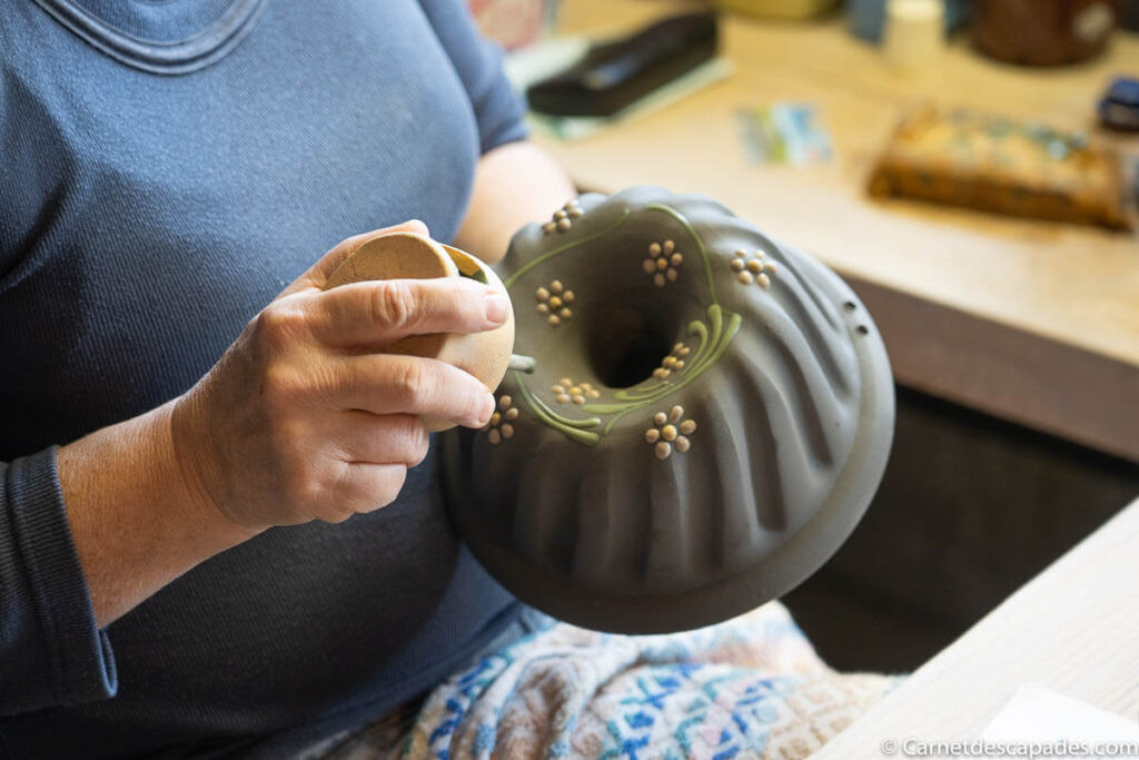 Decorating pottery in Soufflenheim, France