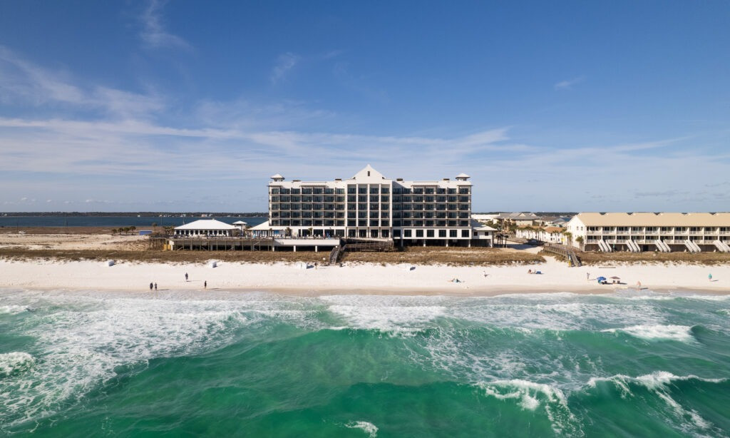 Aerial view of Springhill Suites Navarre Beach, Florida, displaying its beachfront location and amenities