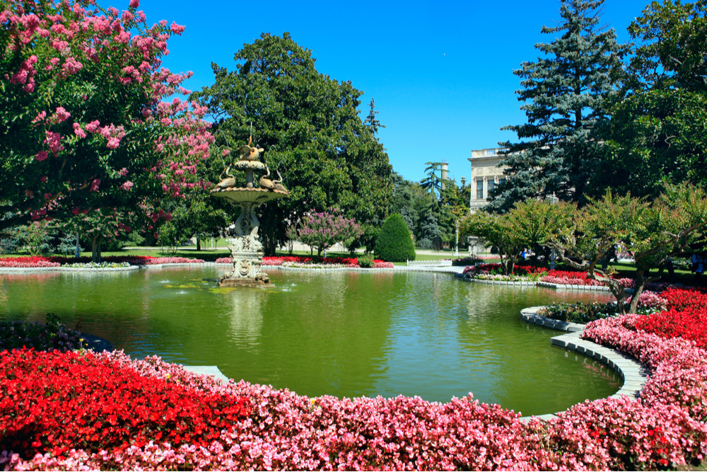Gardens and flowers around a pond at Dolmabahce Palace Istanbul Turkey