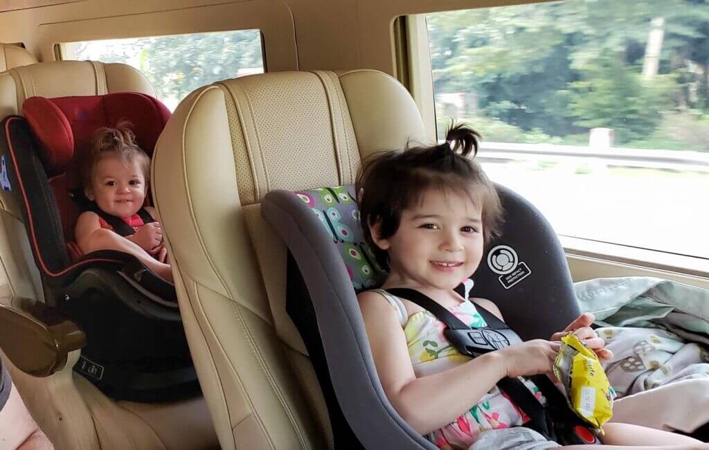 Child in Car Seat in Van