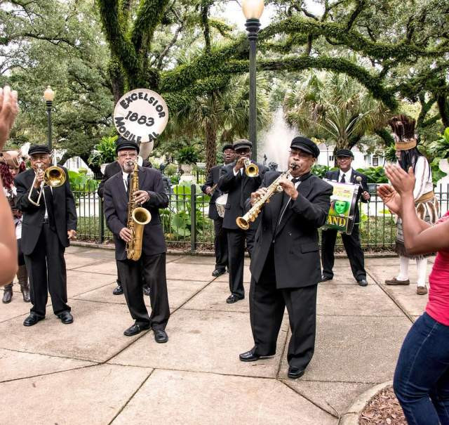 Band playing in a park, bringing the community together in Mobile, AL