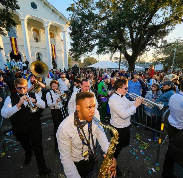 Festive band bringing music to the streets during a lively Mardi Gras parade