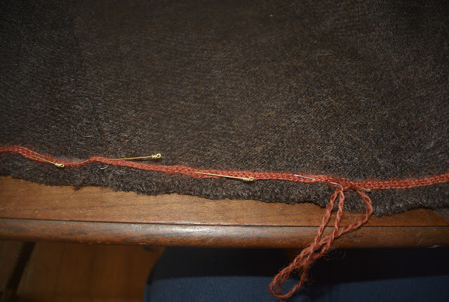 Cloak edge blanket stitched in weaving thread