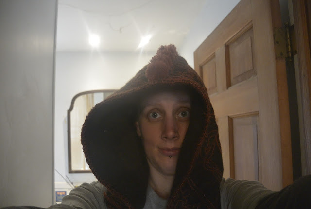 Hood finished and lined with bobbles