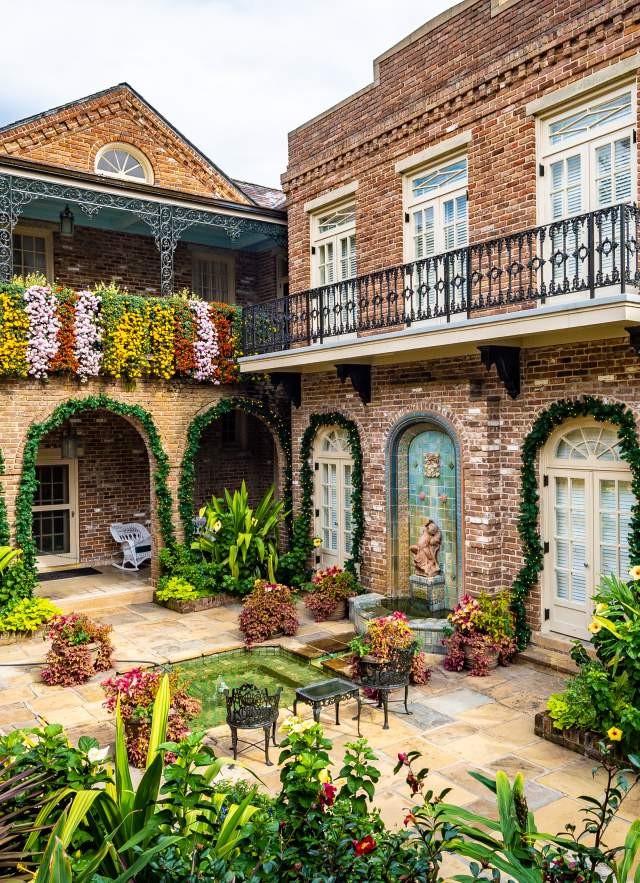 Cascading mums adorn the walls of Bellingrath Gardens, creating a vibrant display