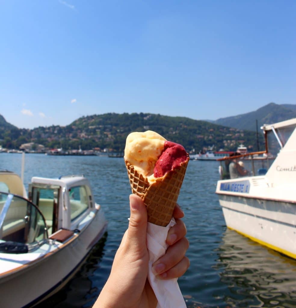 Enjoying gelato by the lake in Como, a perfect way to start your day trip