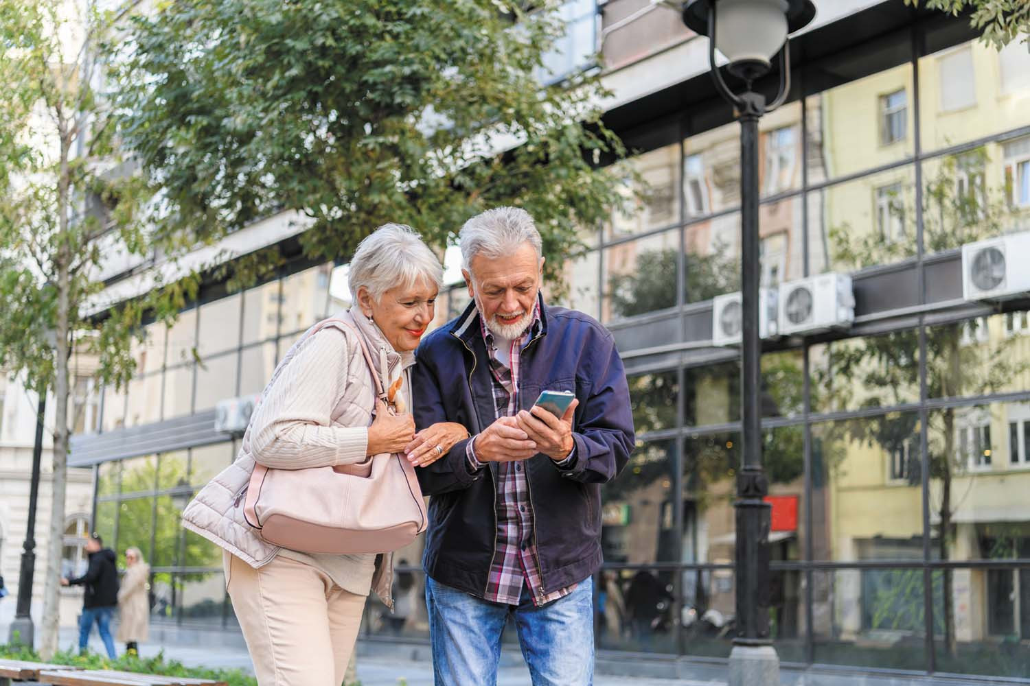 Senior couple looking at a smartphone