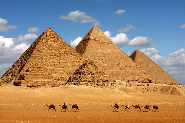 Photograph of the Great Pyramids of Giza. One of the Seven Wonders mentioned by Antipater of Sidon, the Great Pyramids serve as a convergence point for modern and ancient tourism alike.