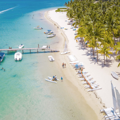 Turquoise waters and white sand beach at Trou aux Biches, Mauritius, a top Mauritius tourism place to visit for its calm waters and family-friendly environment.