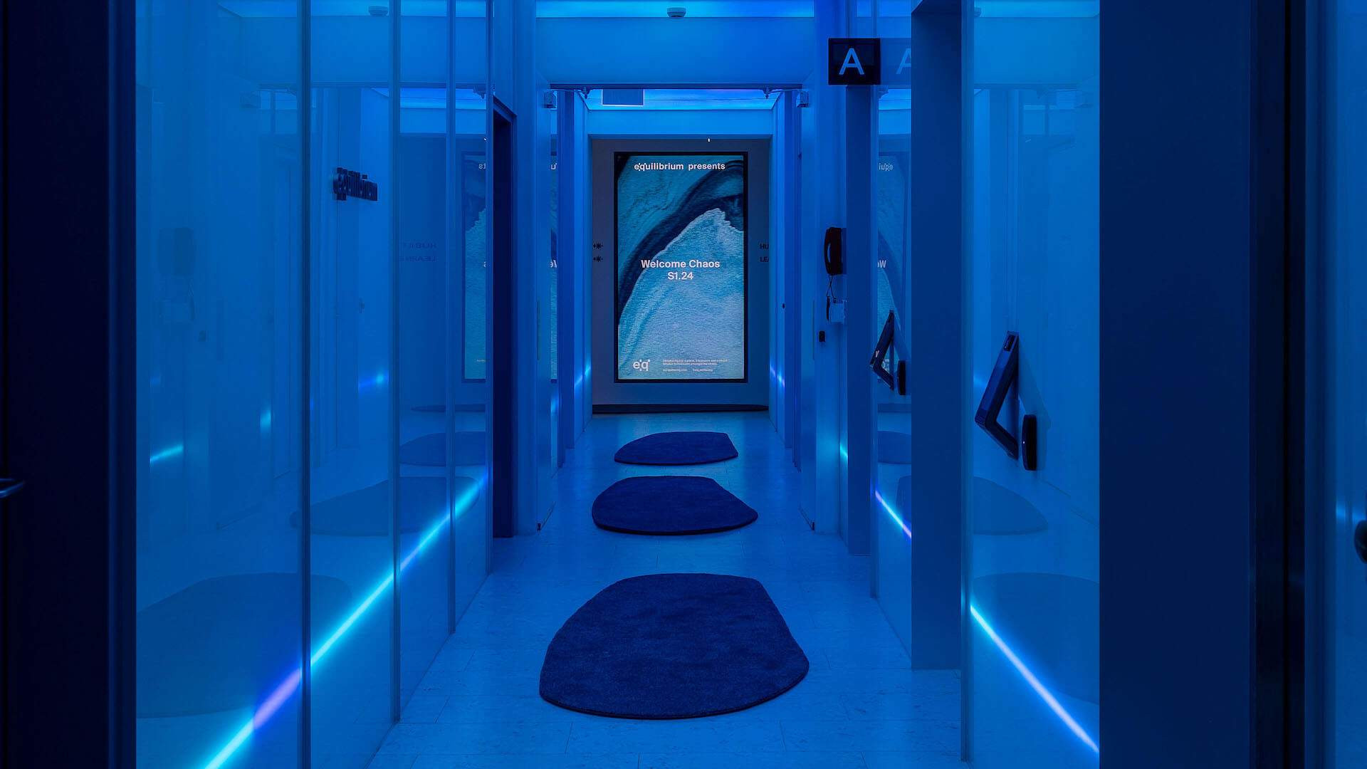 Exterior shot of the EQ Wellbeing spa in Melbourne, featuring modern architecture and signage