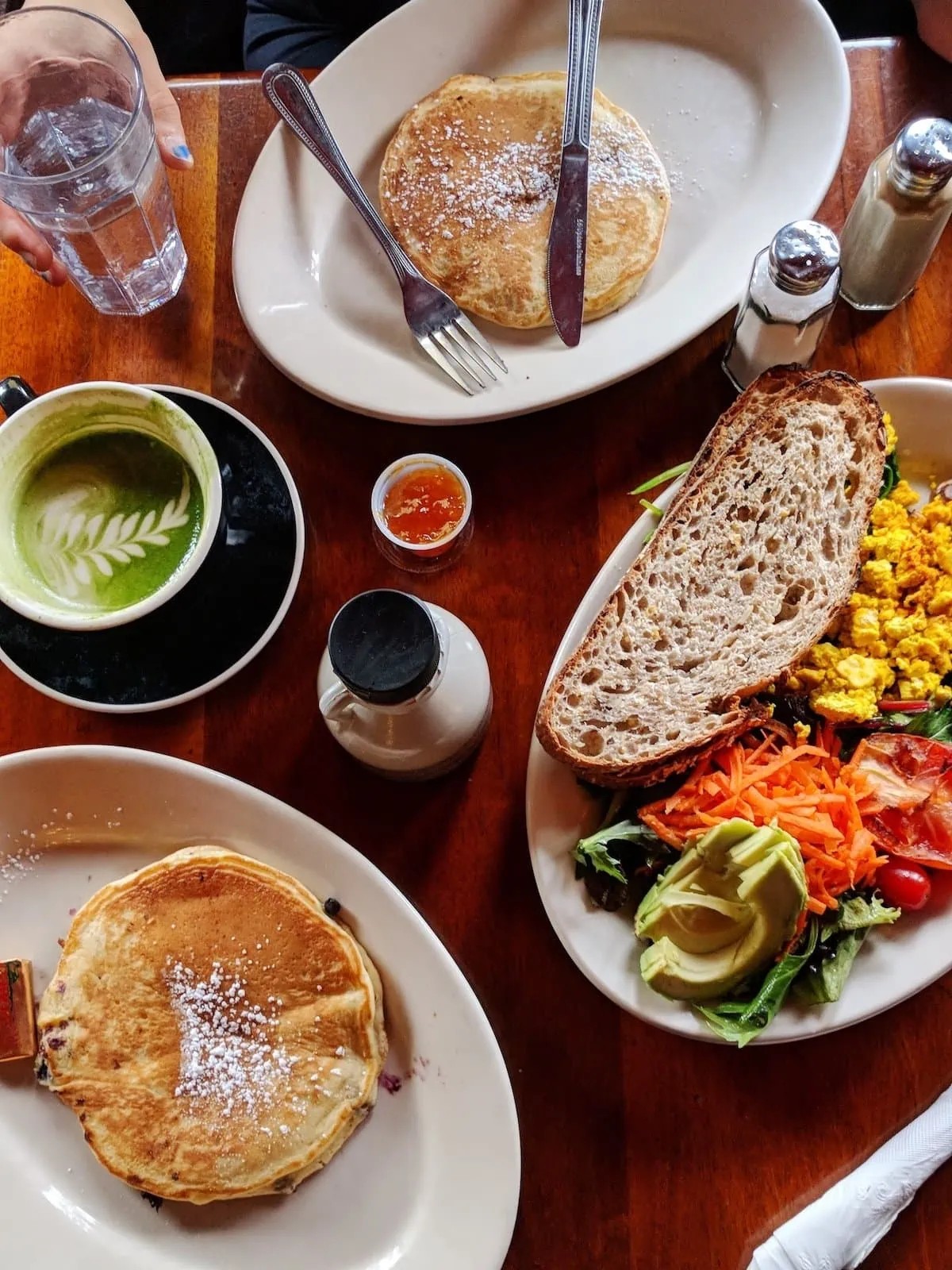 Esselon Cafe vegan brunch, matcha latte, and pancakes