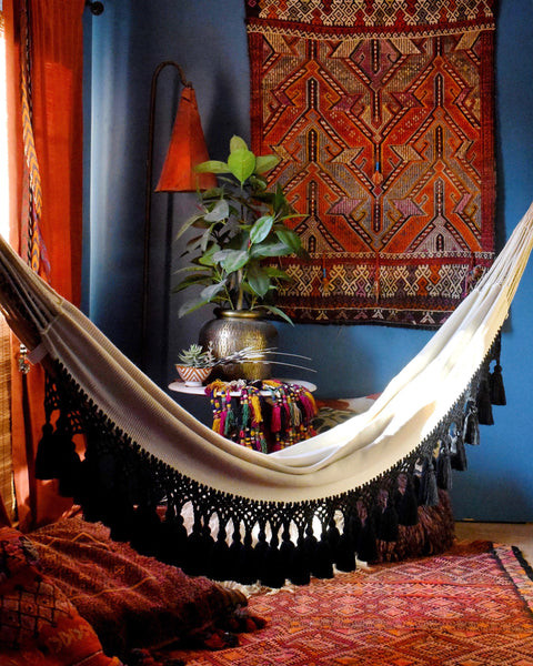 Wide hall transformed into a relaxing hammock room, providing a perfect spot for reading and afternoon naps, reflecting the India World Traveler Collection's versatile use of space