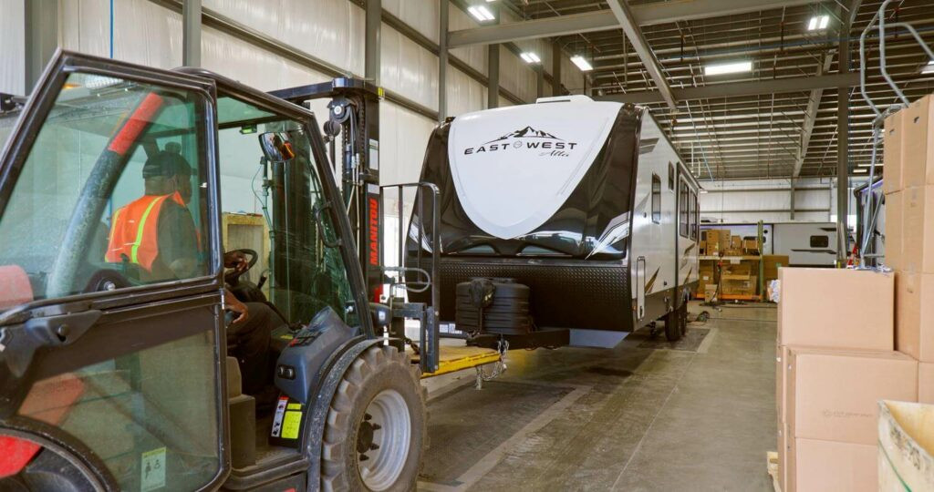 Tractor towing fiberglass laminate RV