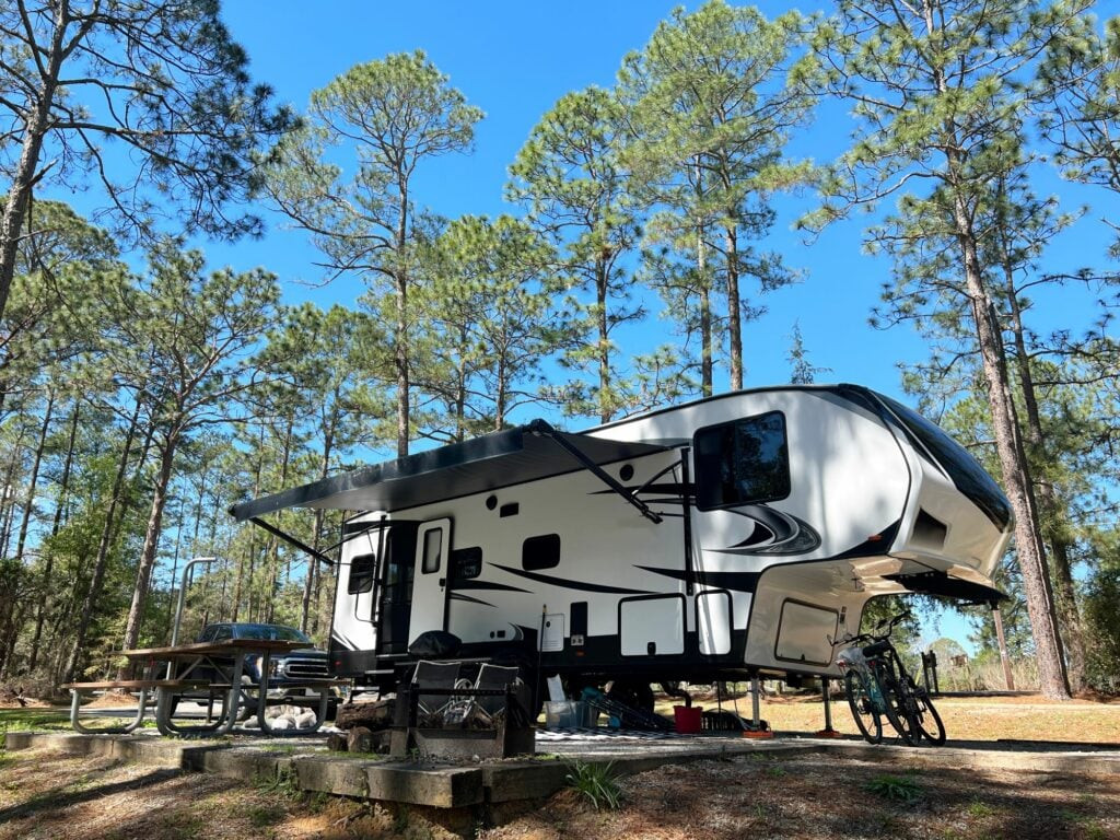 Couple enjoying the view from their travel trailer