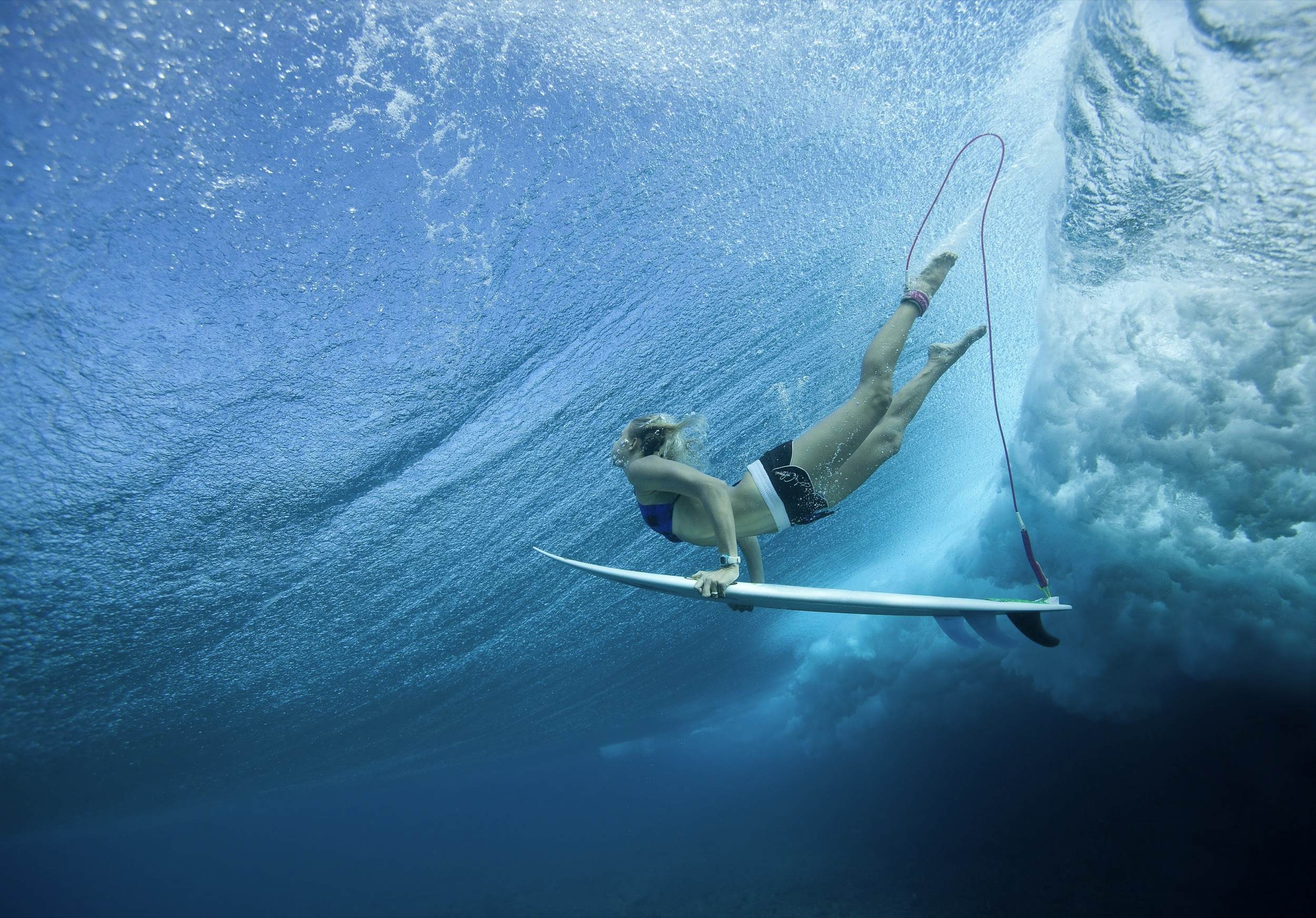 Surfers at Cloud Break Fiji, perfect for surfing during June to September