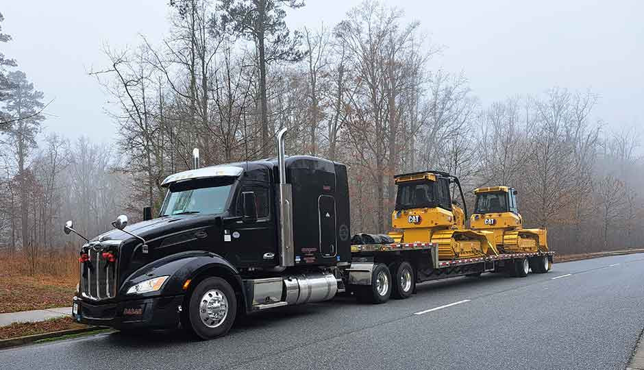 Truck driver inspecting vehicle