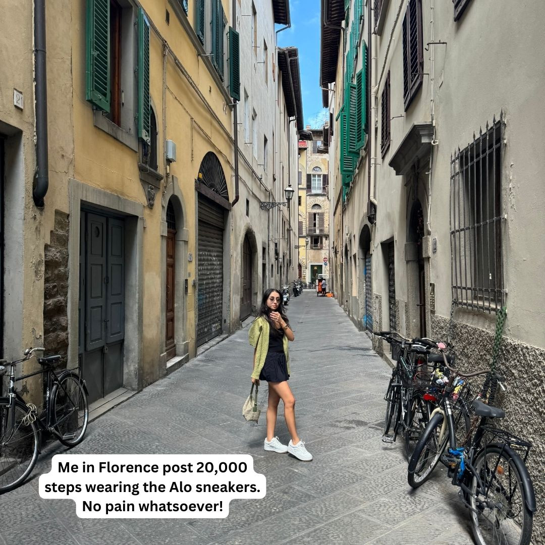 Women wearing white sneakers in Florence, Italy, showcasing stylish and comfortable travel footwear