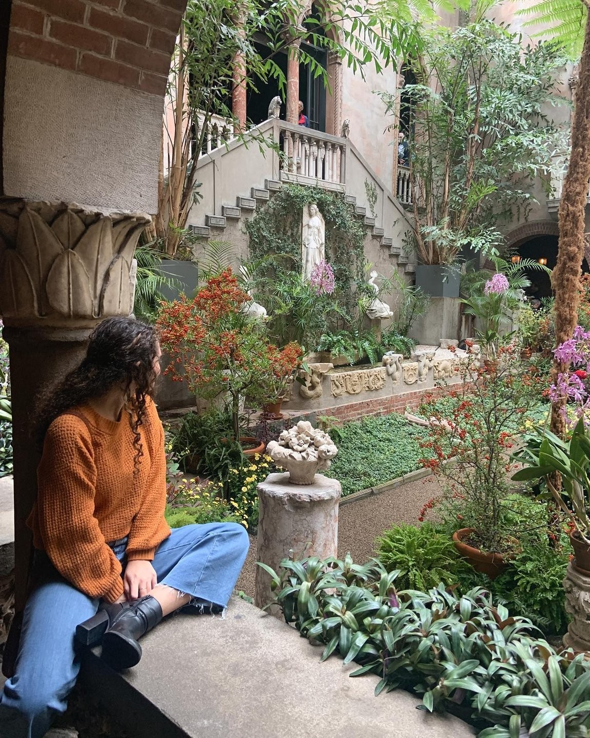 Person looking at the Isabella Stewart Gardner Museum's garden