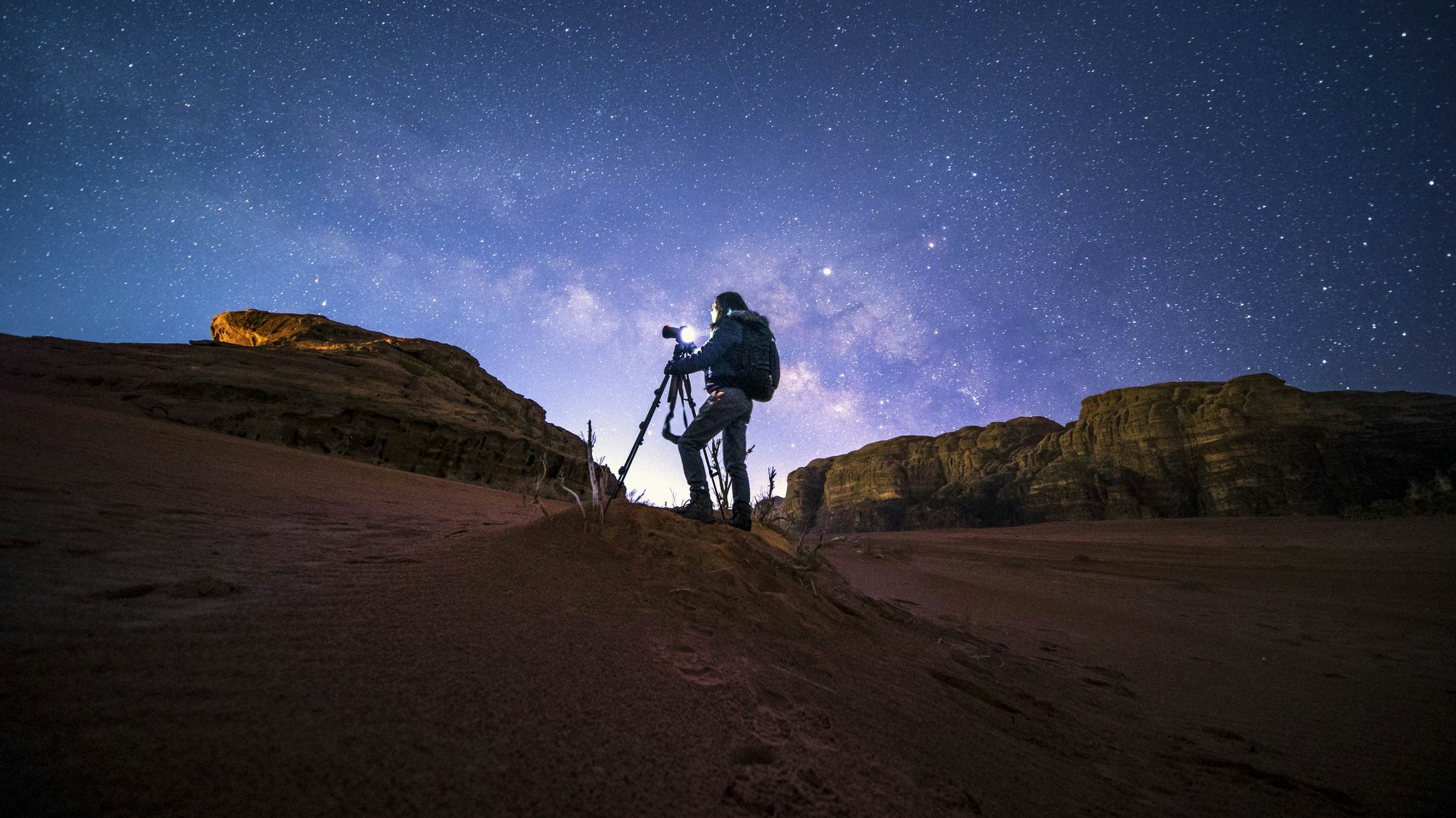 Photographer capturing the night sky in Wai Rum, Jordan